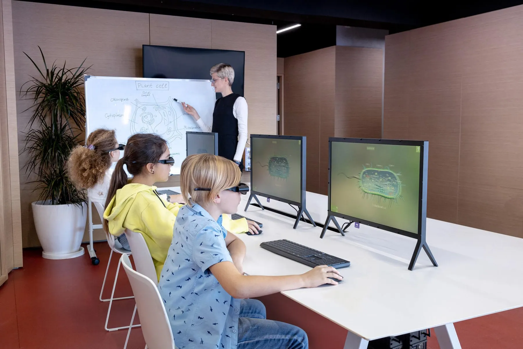 Students using ILLUMETRY IO stations in a classroom