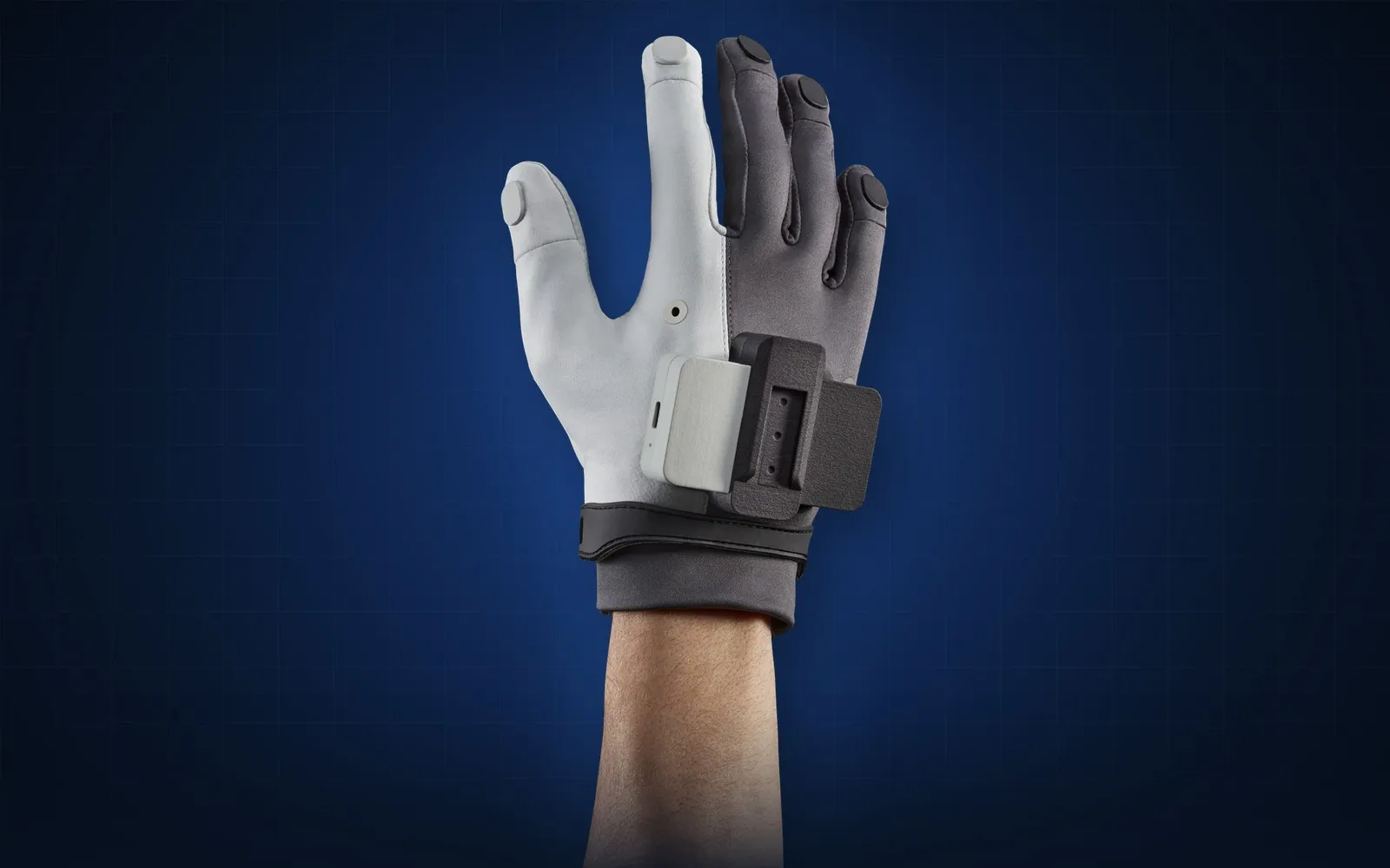 MANUS Metagloves Pro worn on the hand, with the tracking module on the back